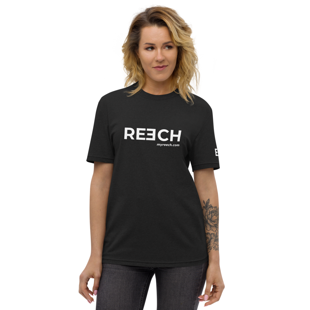 Woman wearing a black t-shirt with the REECH logo and myreech.com, front.
