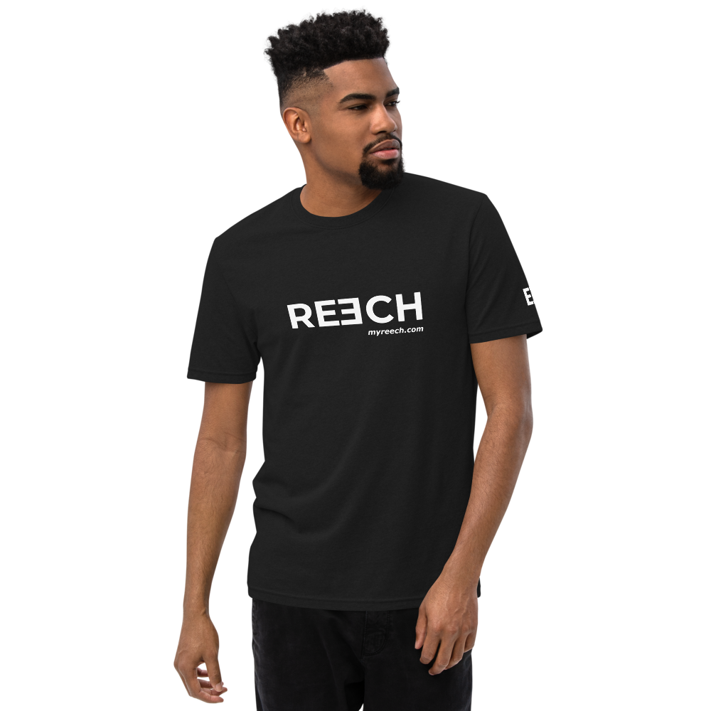 Man wearing a black t-shirt with the REECH logo and myreech.com, front.
